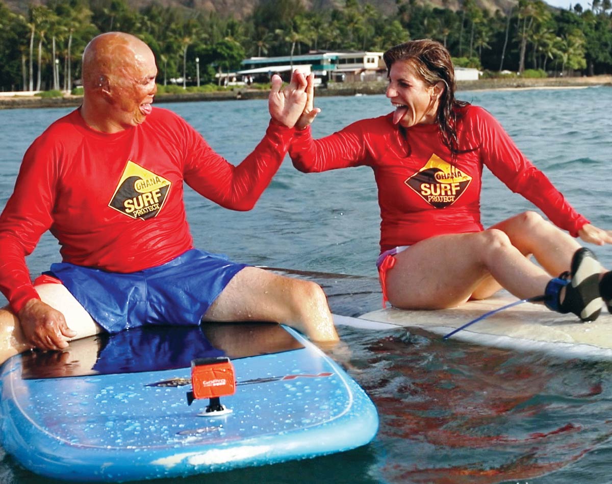 Image of Shilo and his wife Jamie surfing 