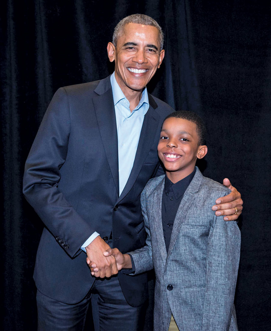 Jahkil Naeem Jackson with President Barack Obama posing for a picture shaking hands