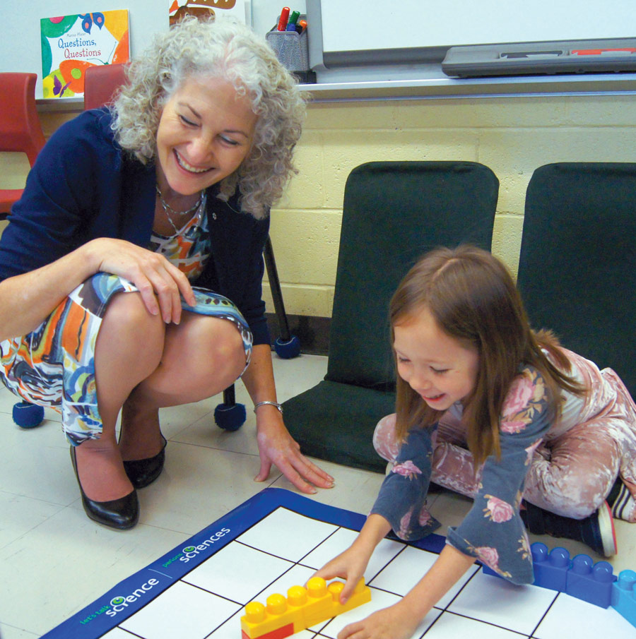 Dr. Bonnie Schmidt engaging with a little girl