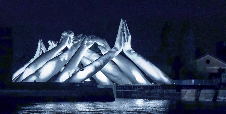 Building Bridges sculpture at night