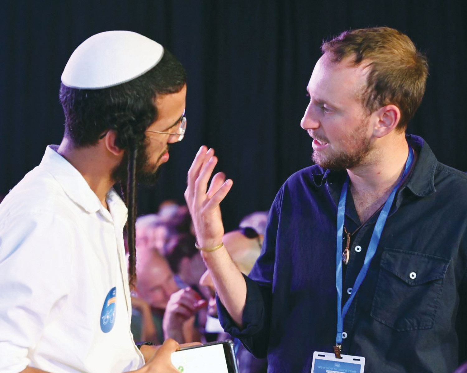 two participants of the Fourth Quarter movement from different backgrounds and locations in Israel engaging in a conversation